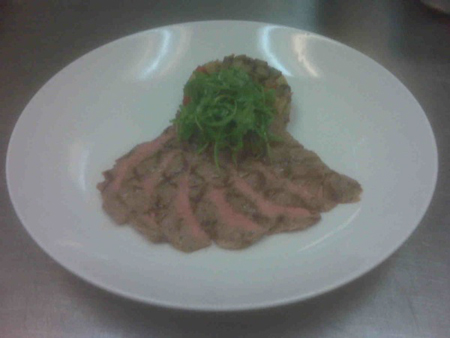 Grilled Confit Veal Flank Steak with Pan Roasted Portabella and Potato Hash and Baby Arugula 