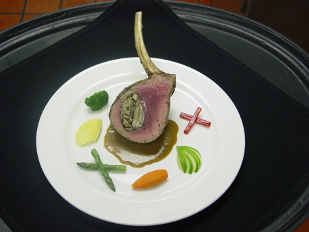 Herb seared Rack of Veal with a Wild Mushroom and black truffle filling, served with a creamed Cognac Demi Glace